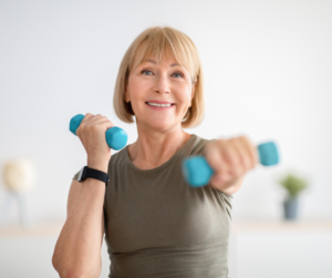 Woman using dumbells.