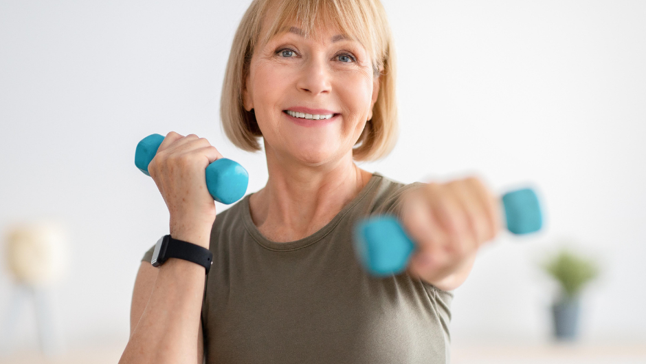 Woman using dumbells.